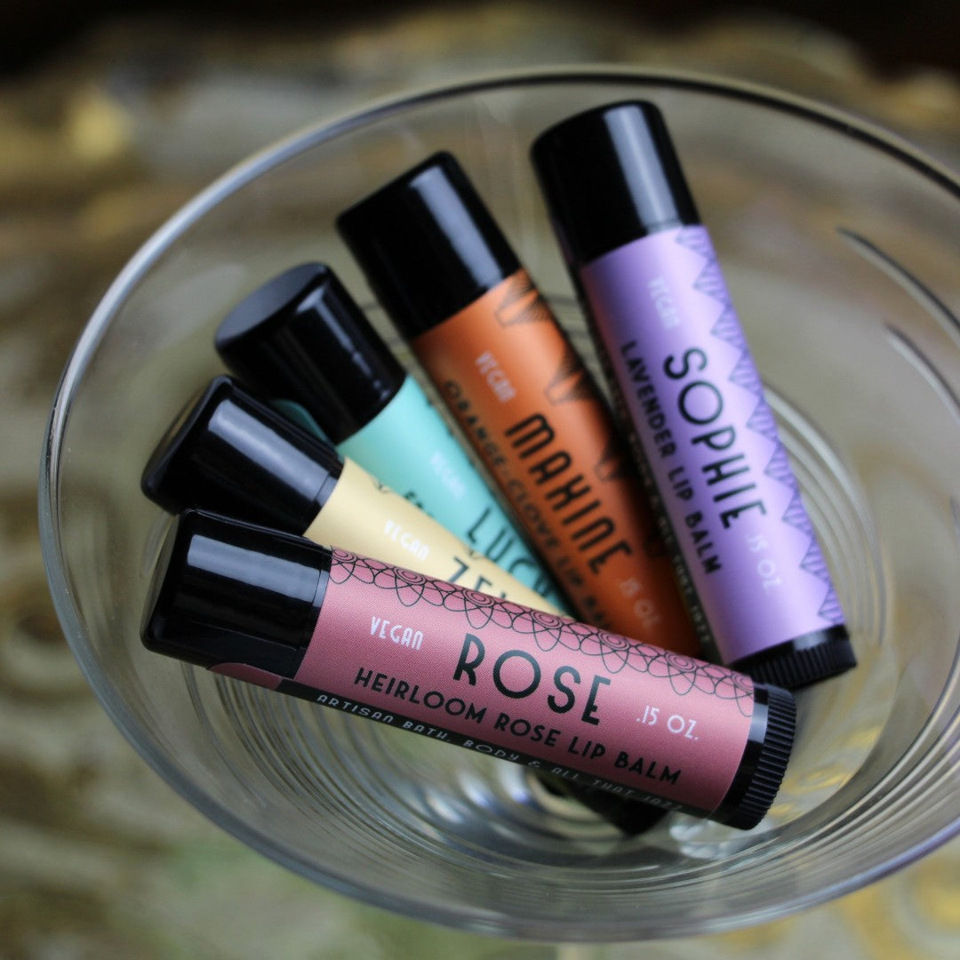 The Flapper Set Vegan Lip Balm- a bundle of five lip balms in a cocktail glass 