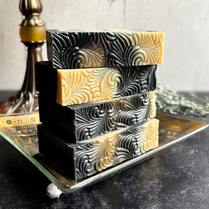 Sacred Embers Handmade Soap, stacked on a vintage, gold dish