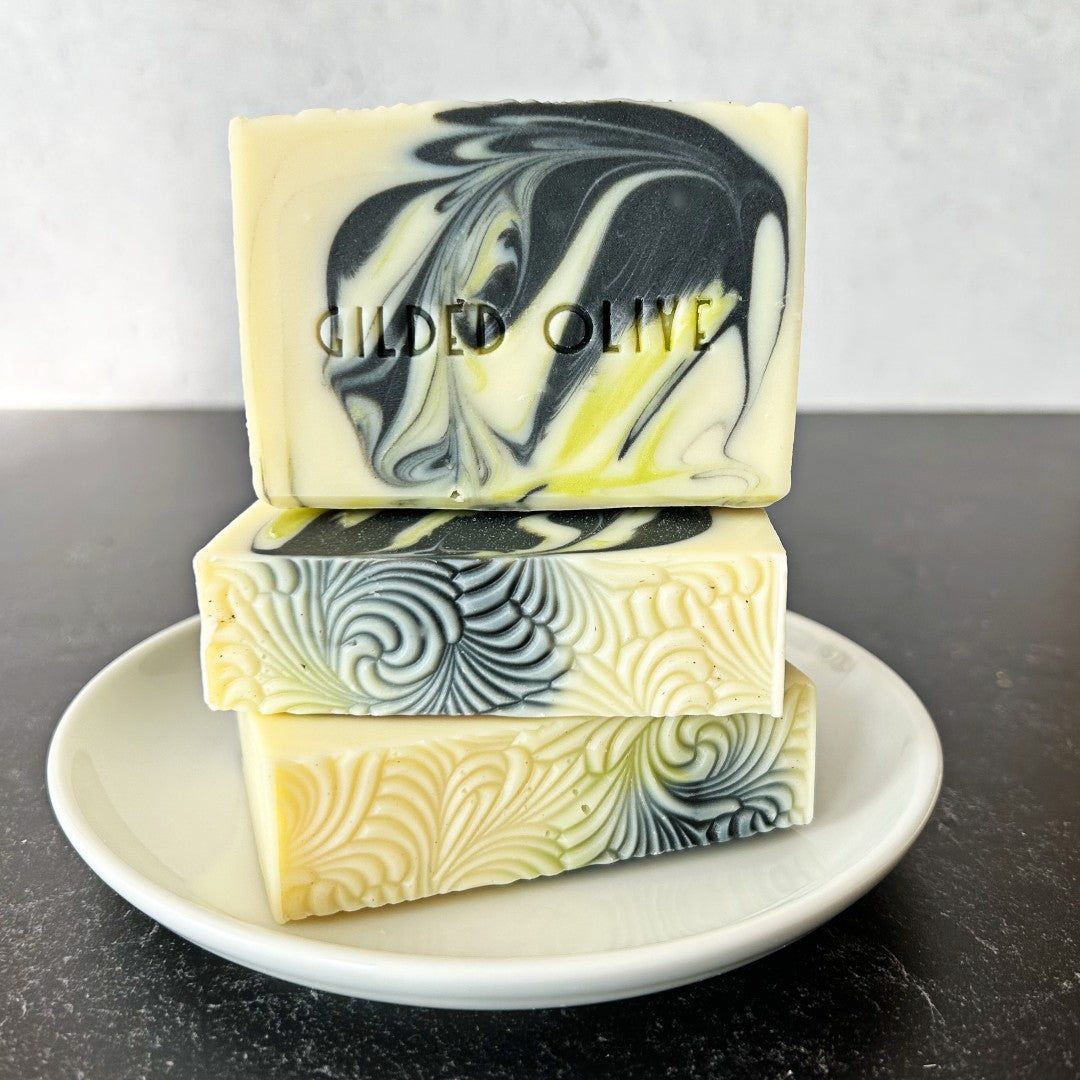 Tea Tree & Lime Handmade Soap, stacked on a white dish